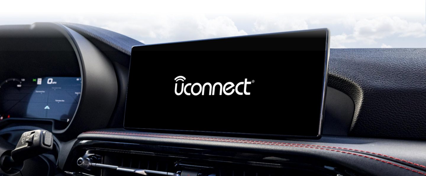 The Uconnect touchscreen in a 2024 Dodge Hornet GT displaying the Uconnect logo.